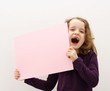 happy girl is holding a board
