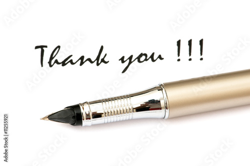 Photo: Thank you message and pen isolated on white Thank you message and pen isolated on white