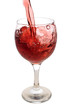 Red wine stream flows into glass
