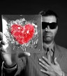 Broken red glass heart businessman metaphor