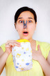 Shocked woman holding up smelly diaper Shocked woman holding up smelly diaper