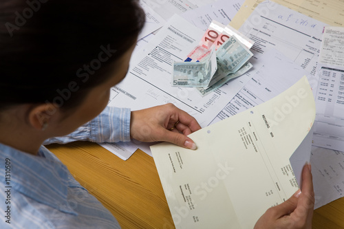Photo: Woman with unpaid bills Woman with unpaid bills