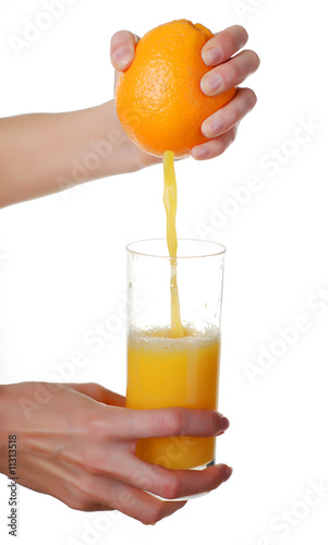 hands and glass of juice