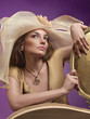 Woman in a hat. A female model wearing a big floppy hat.
