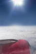 Aerial view of airplane wing and cloudy sky