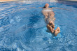 Woman floating in swimming pool