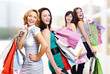 four cheerful adult girls with  purchases