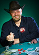 man throws dice on a green background