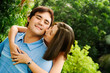 Loving couple embracing, woman nuzzling man's cheek Loving couple embracing, woman nuzzling man's cheek