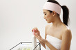 woman taking hand cream from the dispenser