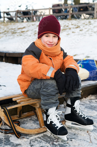 Photo: Little boy on a sled Little boy on a sled