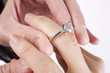 Sliding the engagement ring on