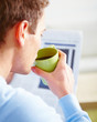 Modern young man drinking morning coffee