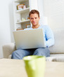 Modern lifestyle - Fresh young man using laptop