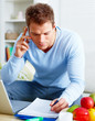 Modern lifestyle - Man paying bills over phone