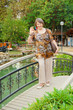 ederly woman on foot-bridge