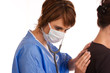 Foto: Female doctor examining a patient using a stethoscope Female doctor examining a patient using a stethoscope