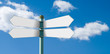 Blank street sign post with 4 white signs Blank street sign post with 4 white signs