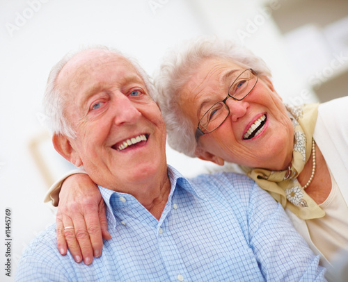 Photo: Closeup portrait of a smiling elderly couple Closeup portrait of a smiling elderly couple