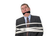 Photo: A tied up businessman A tied up businessman