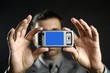 Businessman taking photos, mobile camera