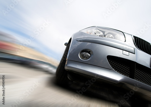Photo: Fast car moving with motion blur Fast car moving with motion blur