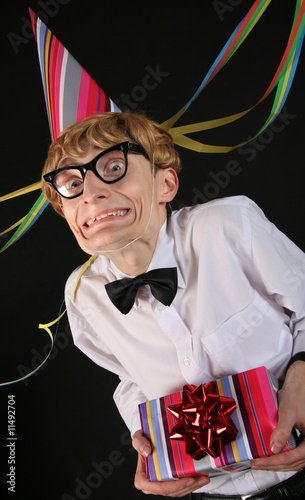Foto: Cute nerd with a birthday surprise Cute nerd with a birthday surprise