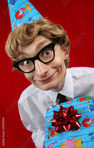 Photo: Cute party boy with a gift Cute party boy with a gift