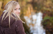 happy blonde looking over her shoulder