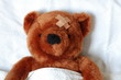 sick teddy with injury in bed sick teddy with injury in bed