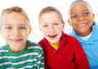 Closeup portrait of three happy boys over white background