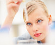 Closeup of beautiful young lady doctor using a dropper