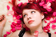 Pretty girl in rose petals