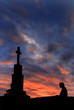 Cross with a person against the sky