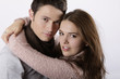 attractive couple holding and looking at the camera attractive couple holding and looking at the camera