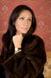 Photo: Beautiful woman with wrist-watch in fur Beautiful woman with wrist-watch in fur