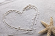 heart drawn in sand