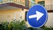 Blue traffic signal, only right. House background