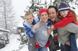 Portrait of happy family in winter setting