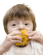 Photo: Toned image of child eating sweetcorn. Toned image of child eating sweetcorn.