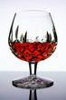 glass of cognac on white background