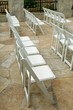 Rows of chairs at an outdoor wedding ceremony