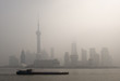 air pollution over Shanghai, a barge is passing air pollution over Shanghai, a barge is passing