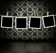 Photos hanging in a dark room