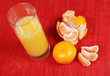 glass of juice and tangerine glass of juice and tangerine