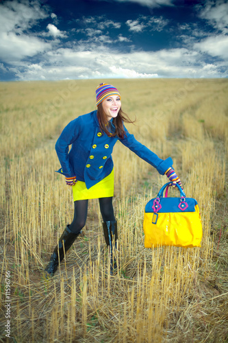 Photo: The stylish young fashionable girl a bag The stylish young fashionable girl a bag