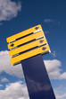 Blank Blue and Yellow Sign over Cloudy Sky