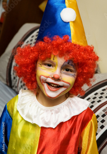 The boy wearing clown