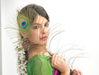 Woman in sari with peacock feather Woman in sari with peacock feather