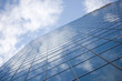 clouds reflection on highrise glass building against sky clouds reflection on highrise glass building against sky